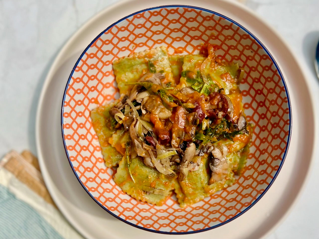 Spinach and Ricotta Agnolotti with Leeks, Artichokes & Olives in a Tomato Sauce