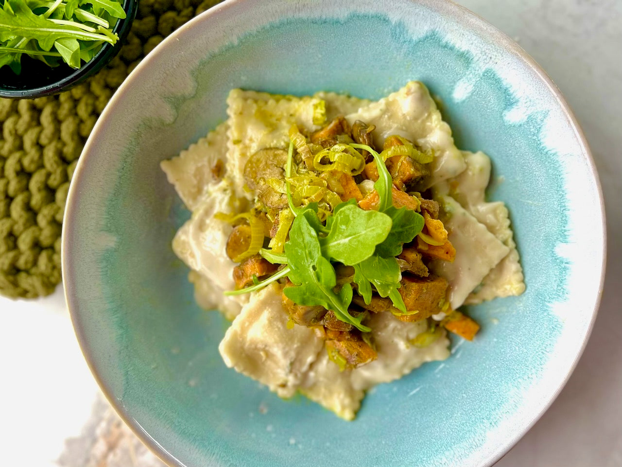 Butternut Squash Ravioli with Arugula, Leeks & Mushrooms in a Sage Cream Sauce