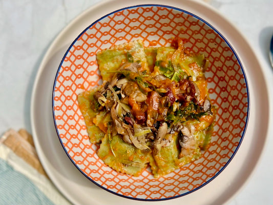 Spinach and Ricotta Agnolotti with Leeks, Artichokes & Olives in a Tomato Sauce